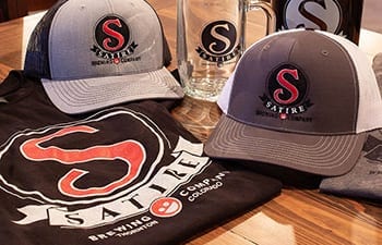 Hats and shirts from Satire Brewing Company Thornton Colorado