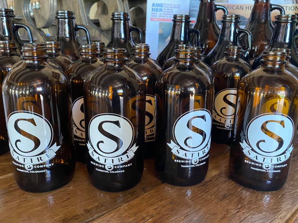 Many Satire brewing company growlers