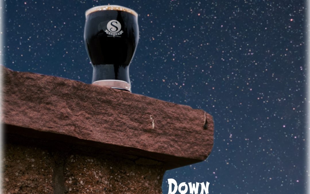 Satire Brewing Company glass of Down the Chimney on cliff with stars