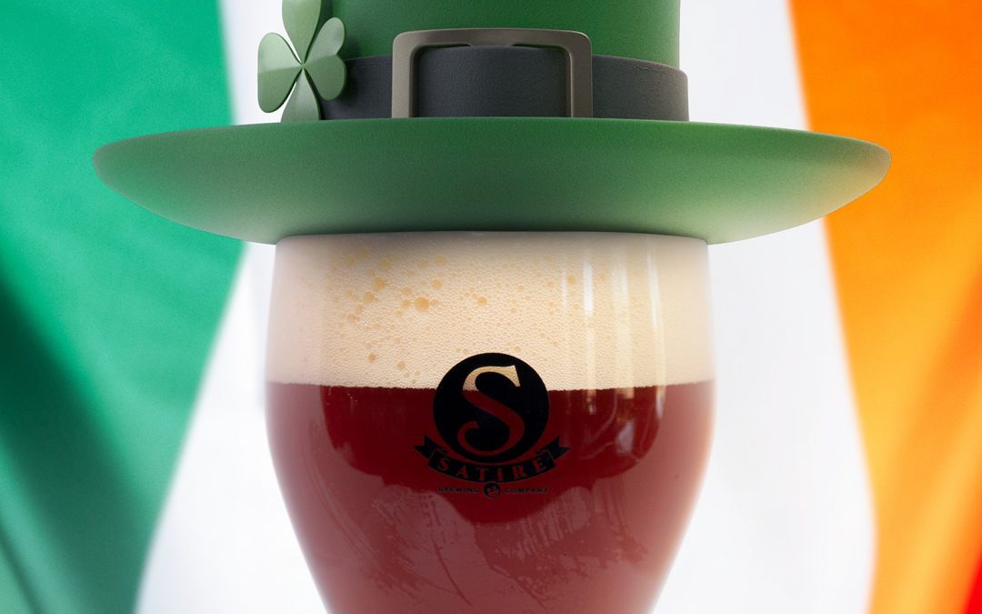 Beer with a leprechaun hat and an Irish flag in the background